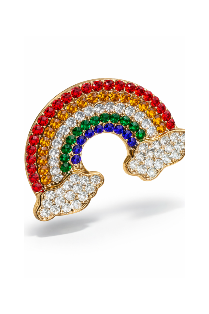 Rainbow-shaped jewelry piece with colorful stones 