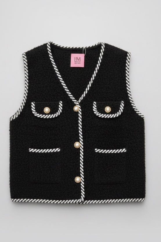 Black textured vest with white stitching.