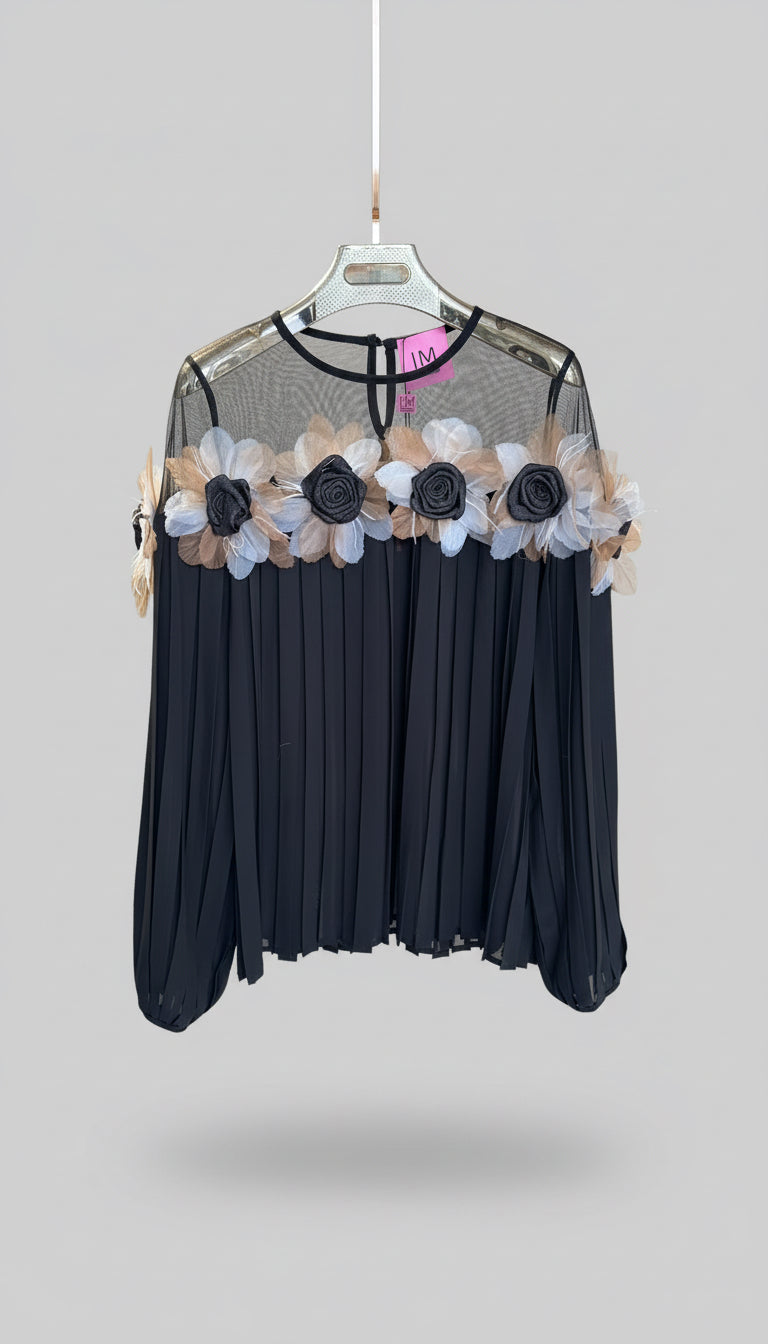 Black top with floral decorations