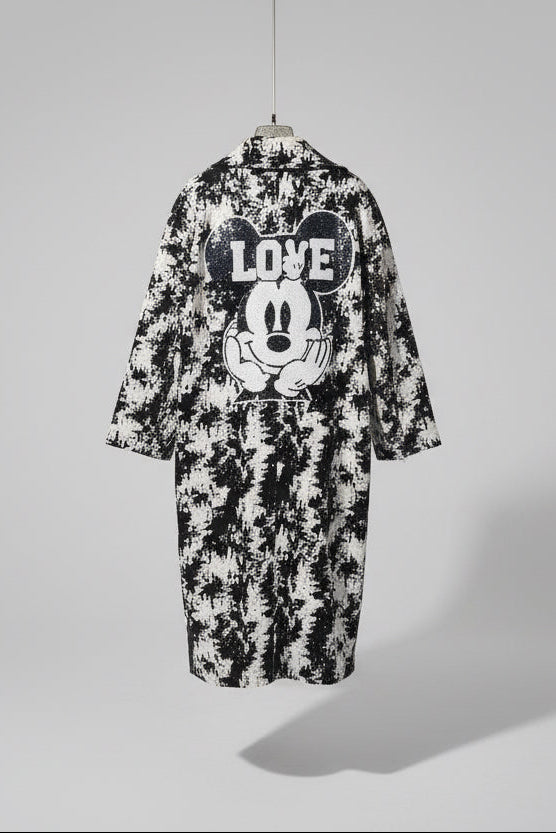 Black and white coat with a graphic design of a character and 'LOVE' text.
