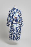 Blue and white patterned coat with cartoon character design.