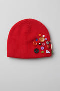 Red knit beanie hat with decorative buttons