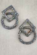 Pair of silver hoop earrings with geometric design