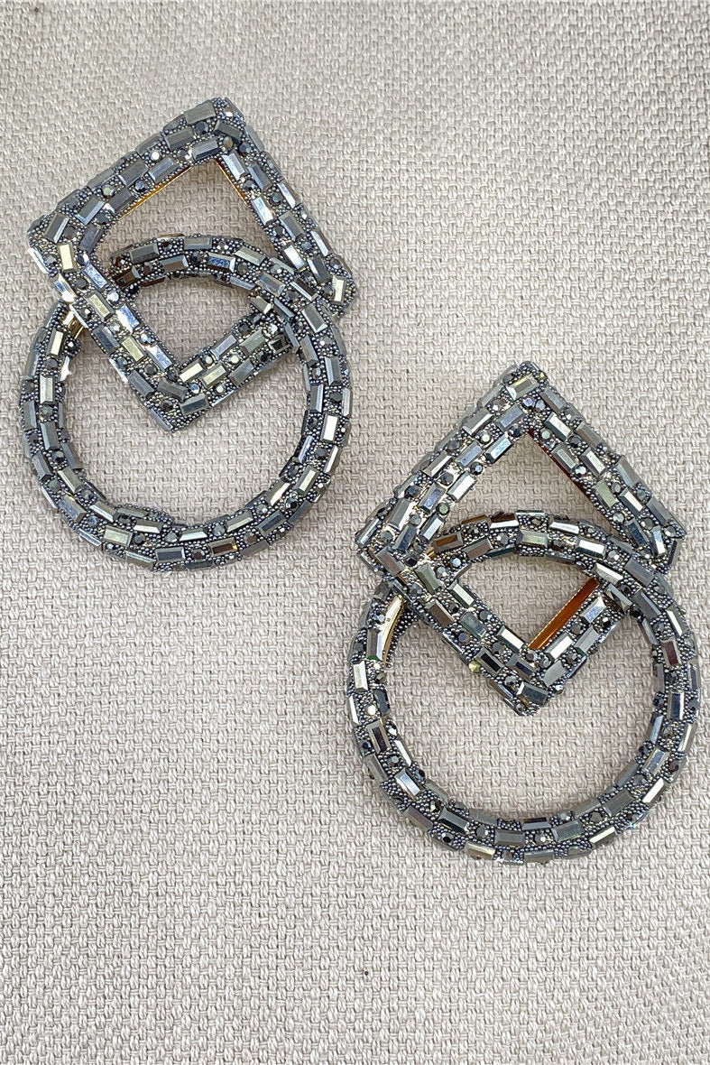 Pair of silver hoop earrings with geometric design
