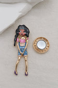 Decorative brooch with a stylized character 
