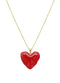 Red heart-shaped pendant on a gold chain 