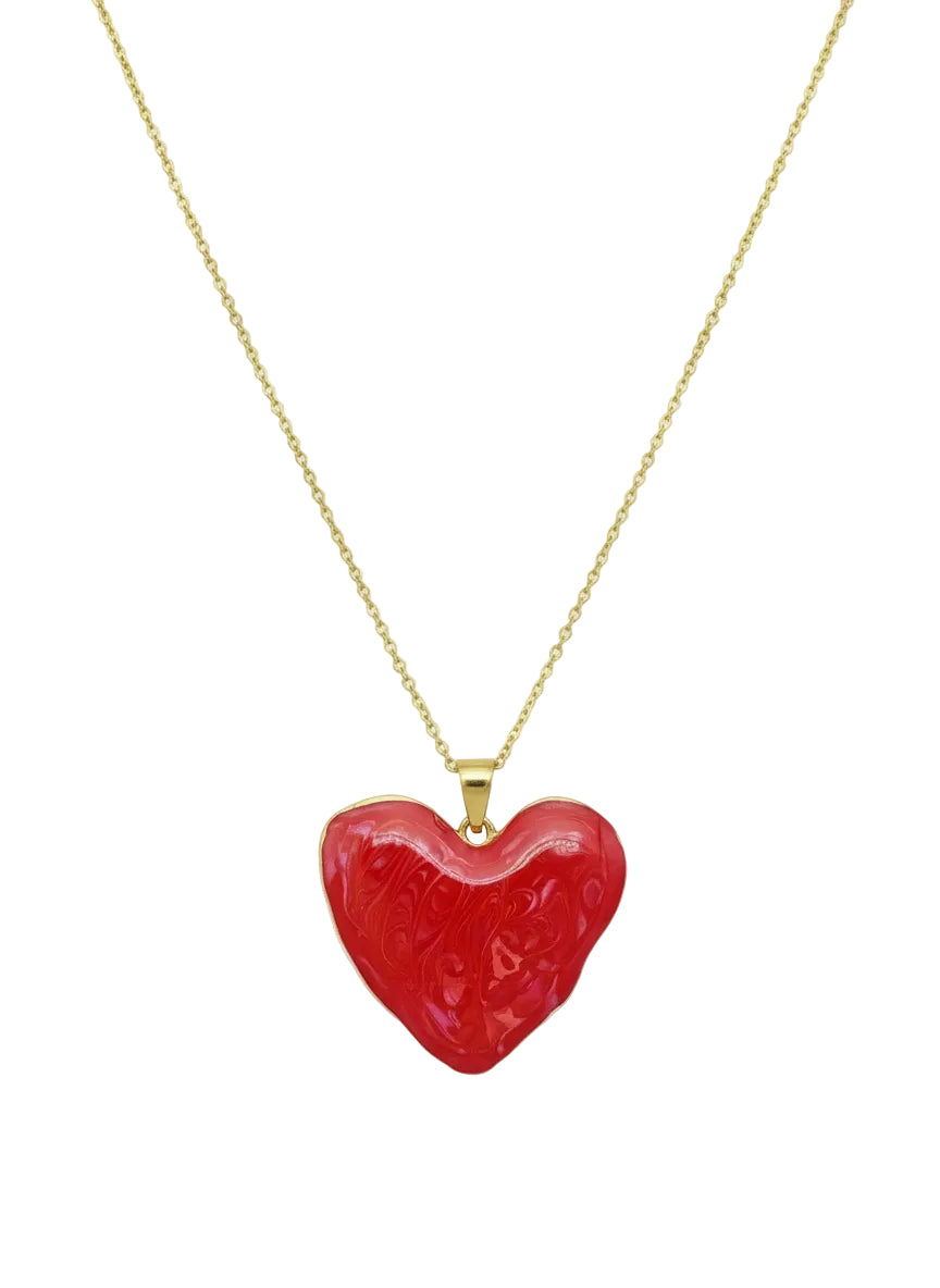 Red heart-shaped pendant on a gold chain 